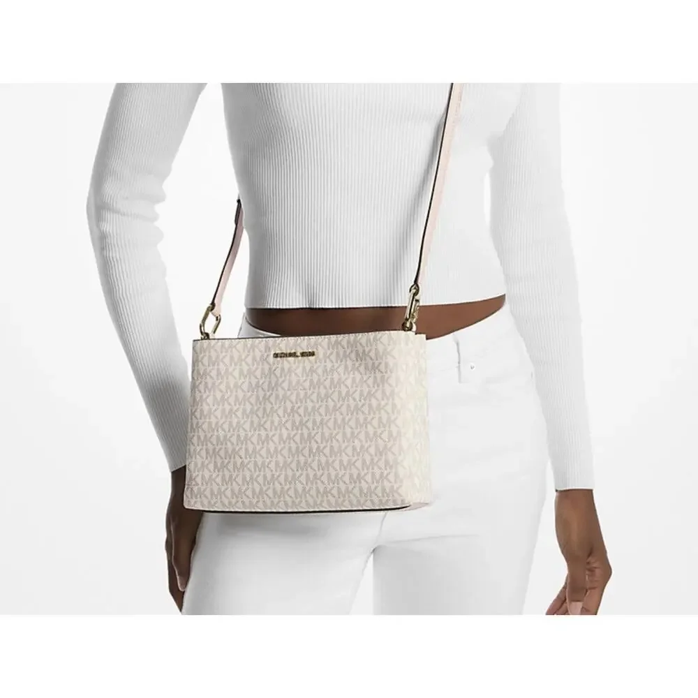 Michael Kors Trisha Medium Logo Crossbody Bag in a vanilla/light cream and pink